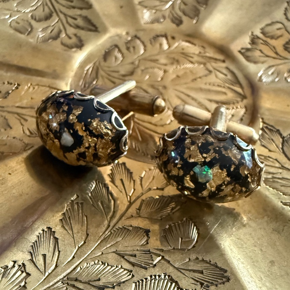 Gold and Black Cuff Links with gold flake and opal-like detail.